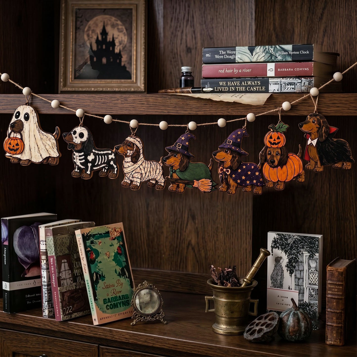 Halloween-themed wooden dog cutout garland hanging on a dark wood shelf, featuring different dog costumes including ghost, skeleton, mummy, witch, pumpkin, and vampire, styled with books and seasonal decor.