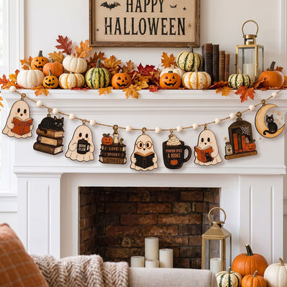 A cozy Halloween-themed fireplace mantel decorated with pumpkins, fall leaves, a lantern, and a wooden 'Happy Halloween' sign. A string banner garland hangs across the mantel, featuring cute ghost and mug-shaped wooden cutouts with spooky designs like 'Read a Book', 'Love a Ghost', and 'Spooky Night & Books'.