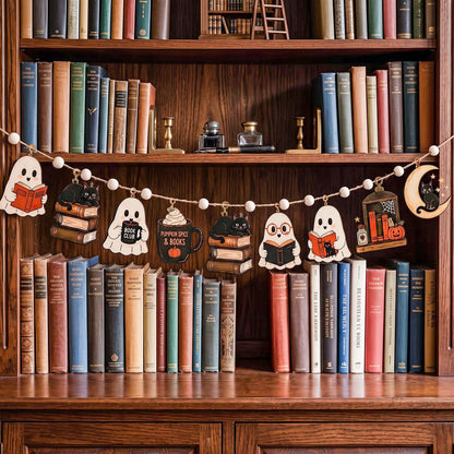 A Halloween-themed wooden bookshelf garland featuring cute cartoon characters reading books, ghosts, a mug, and a moon, hung across a wooden bookshelf filled with vintage books.